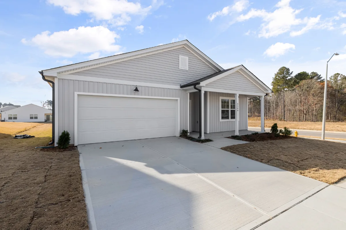 New construction home with freshly poured concrete driveway in the NC Foothills — The Concord Concrete Company
