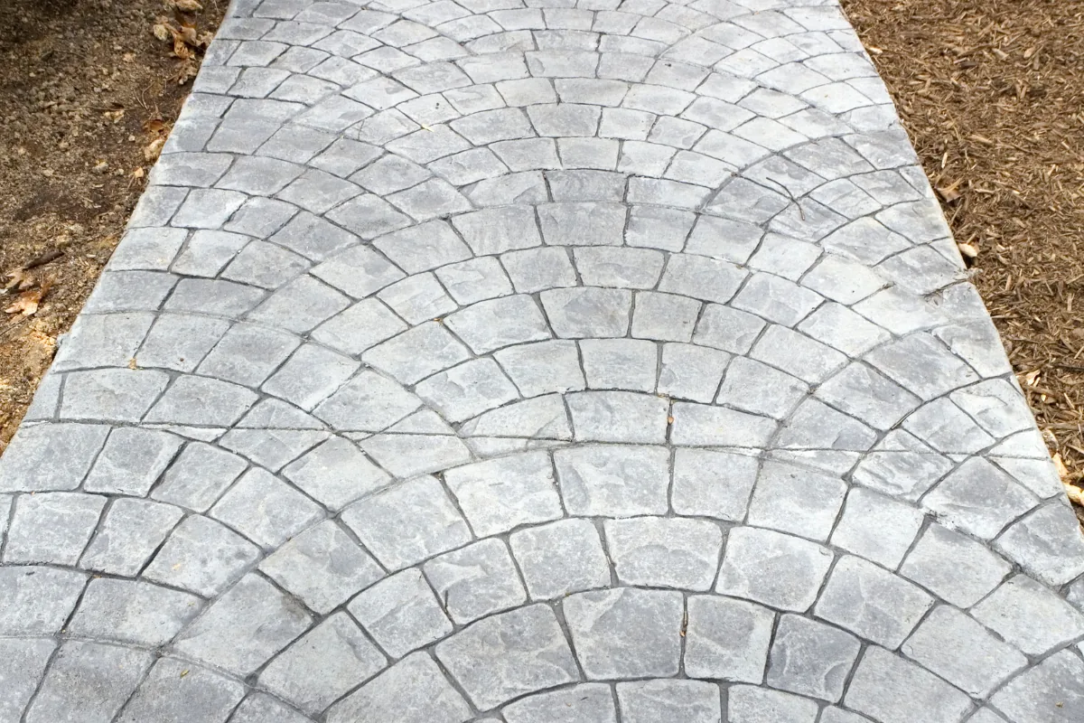 Stamped cobblestone-pattern concrete walkway NC Foothills — The Concord Concrete Company